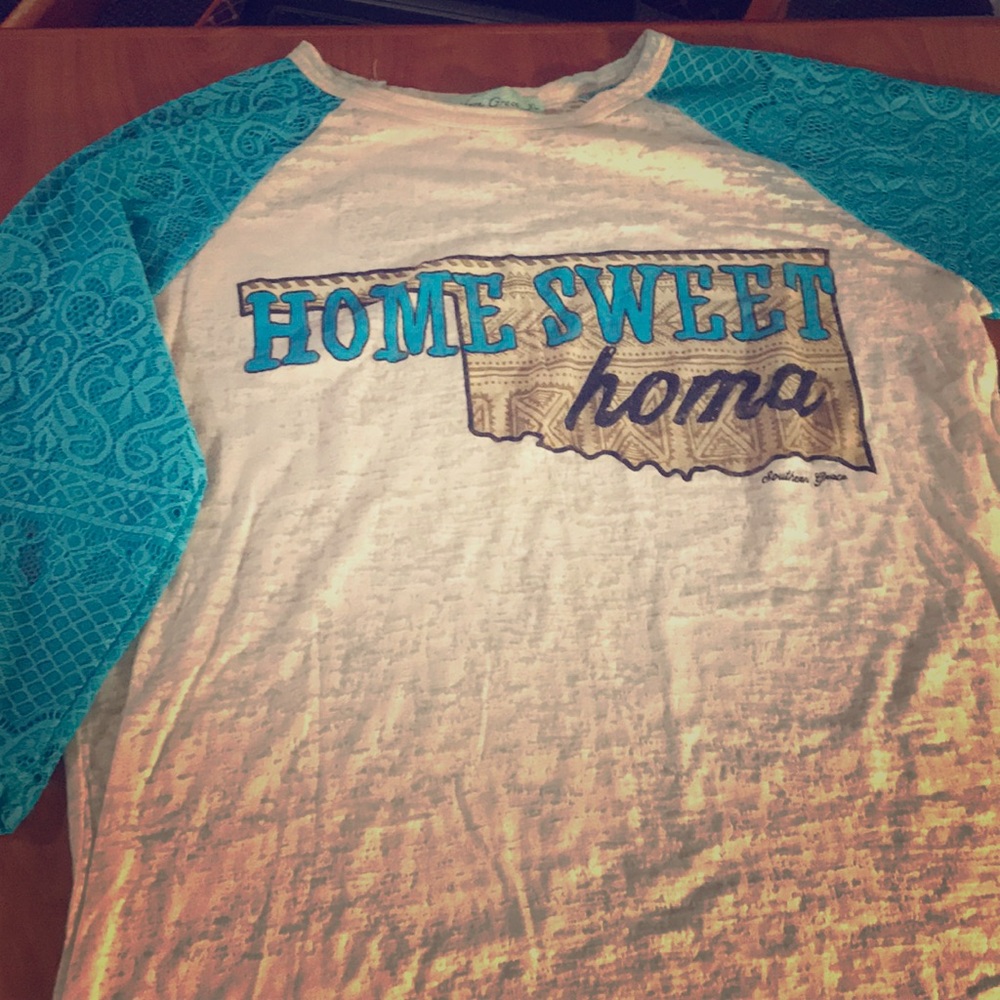 A tan and blue Southern Grace t-shirt